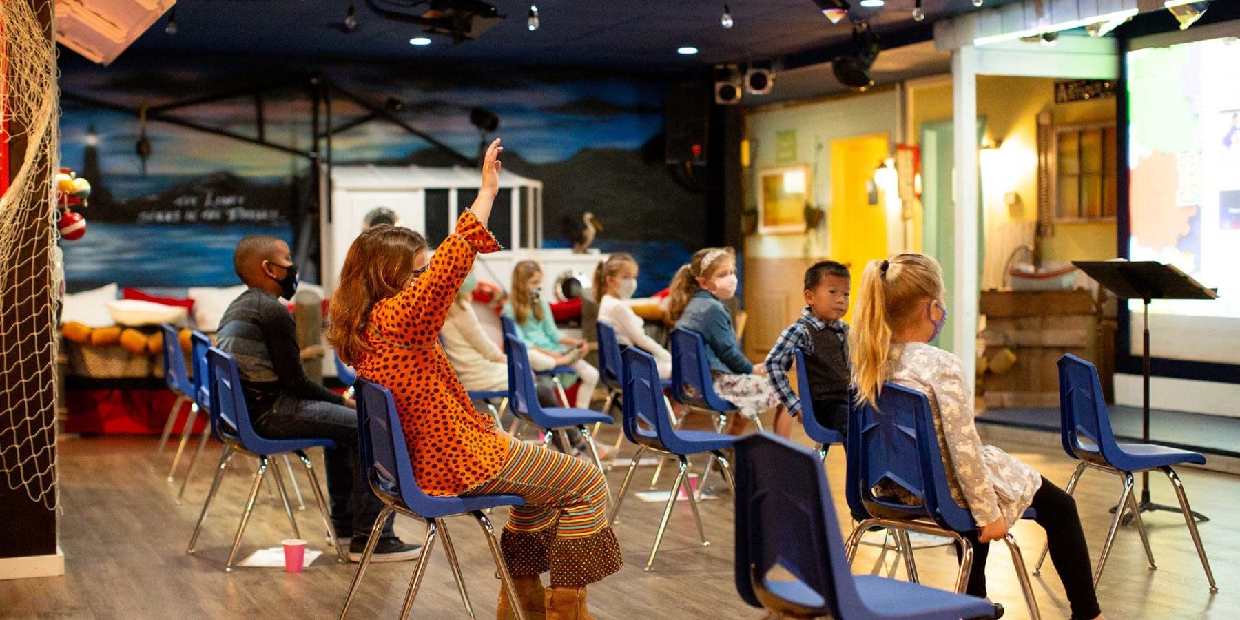 Children listen in a church classroom